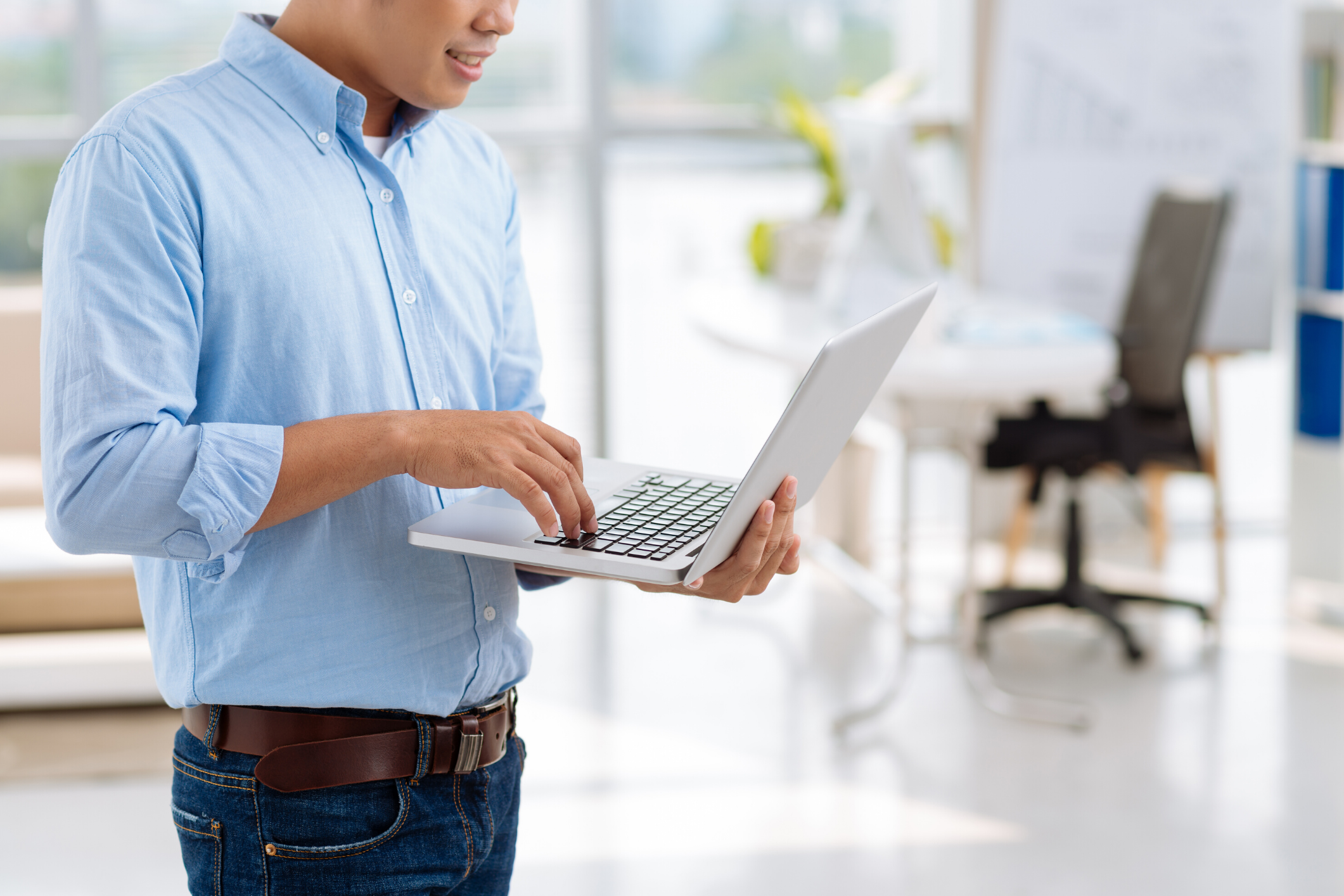 man holding a laptop