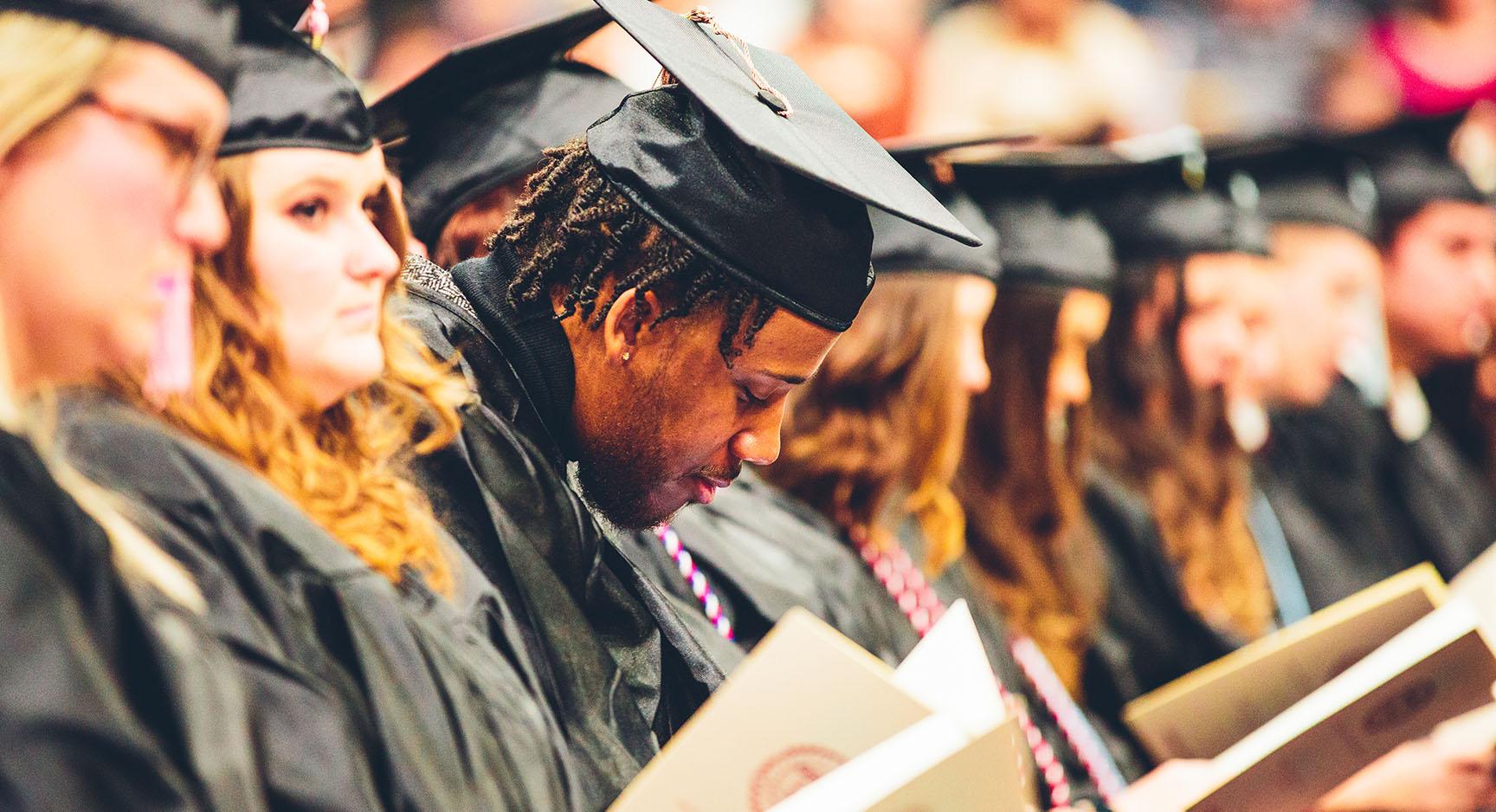 Graduates sitting at Commencement